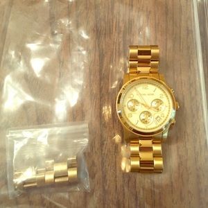 Gold Michael Kors watch.